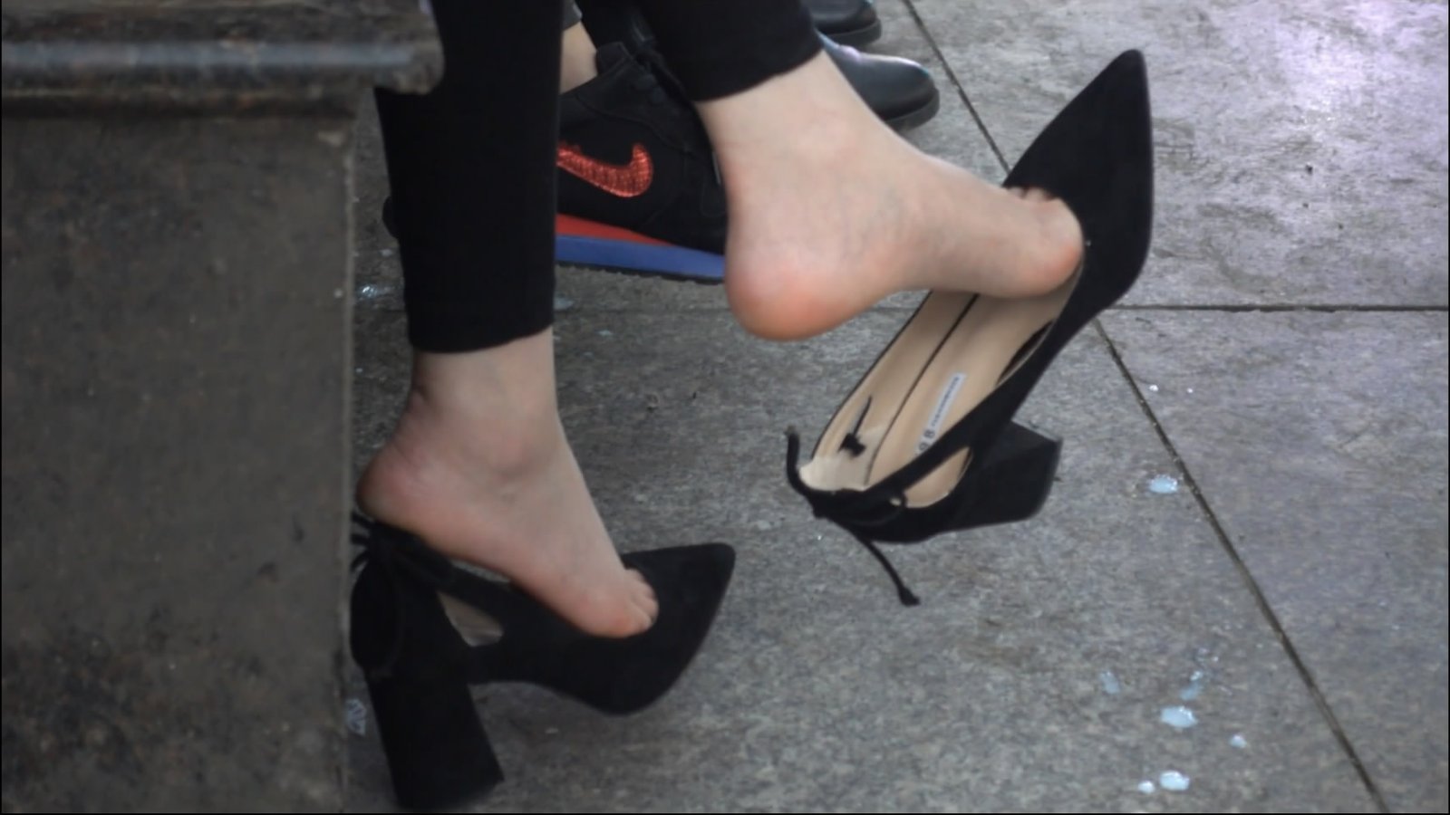 Woman with child and phone is dangling